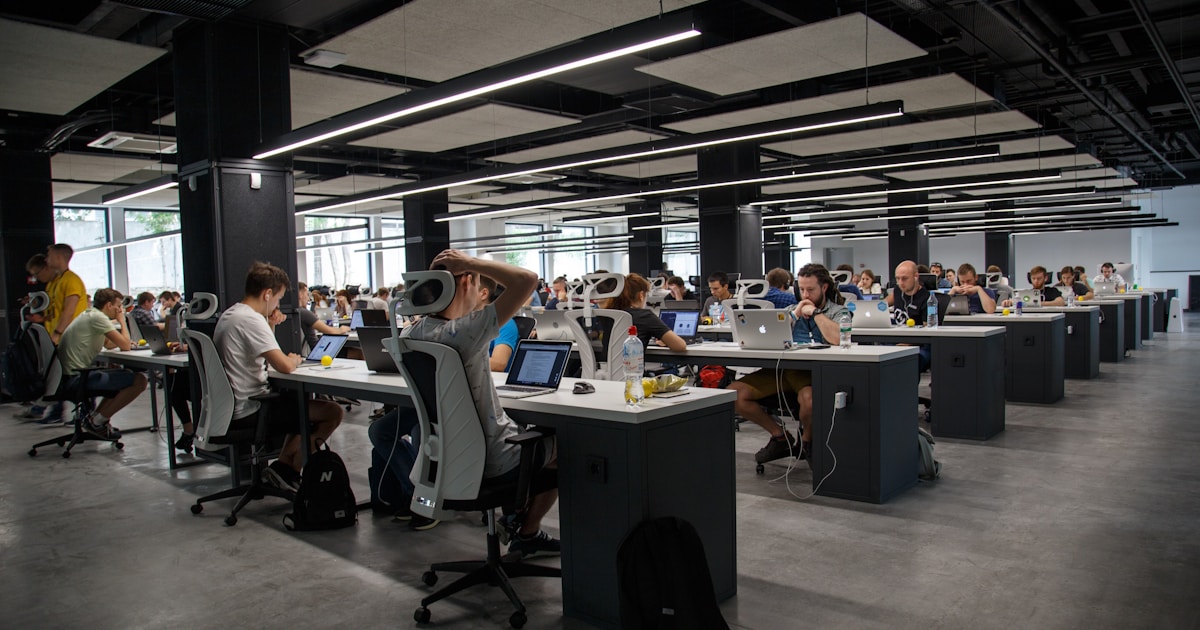 Modern tech company office workspace representing the industry being reshaped by AI
