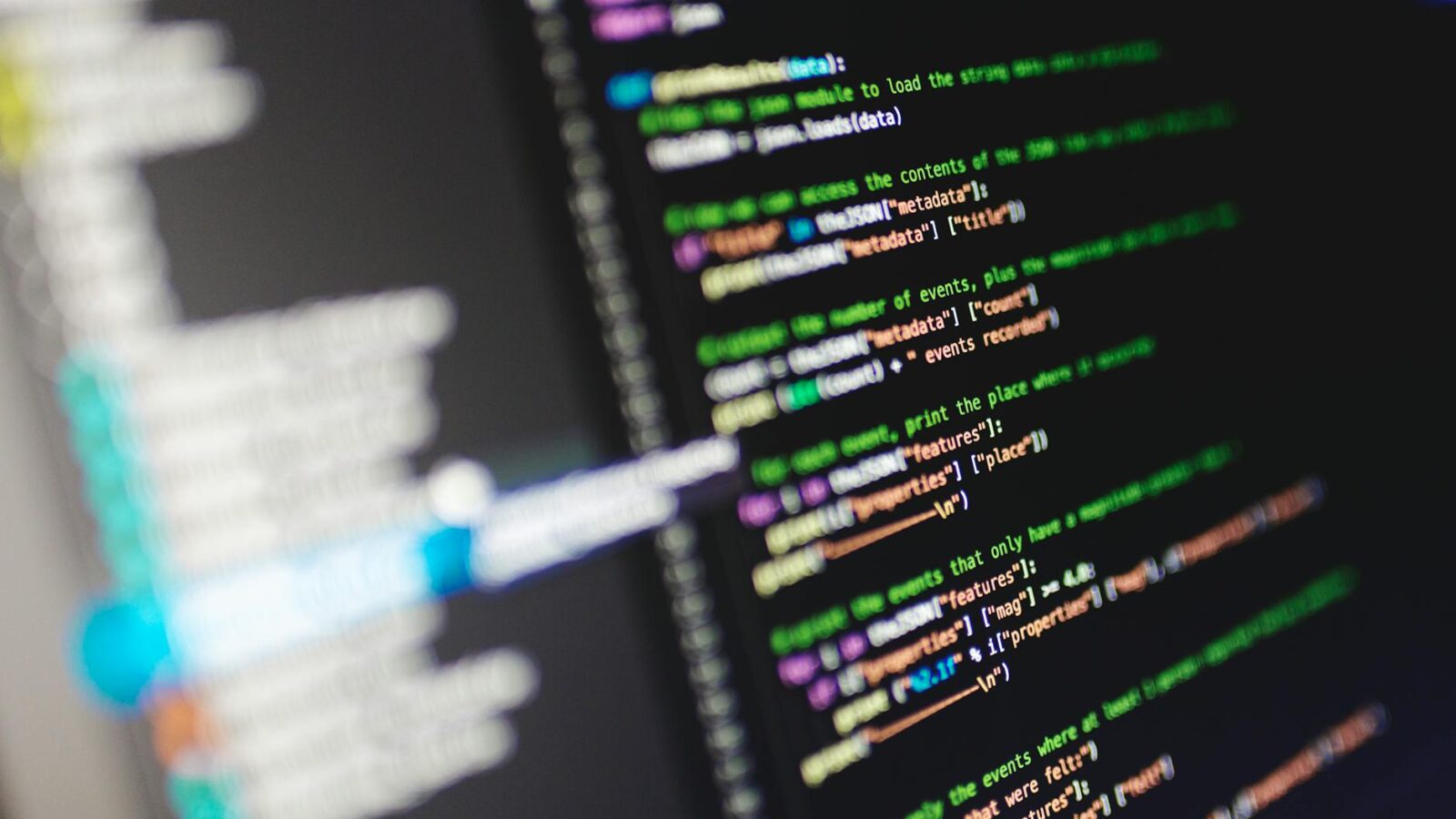 Close-up of a computer screen displaying colorful programming code in JavaScript.