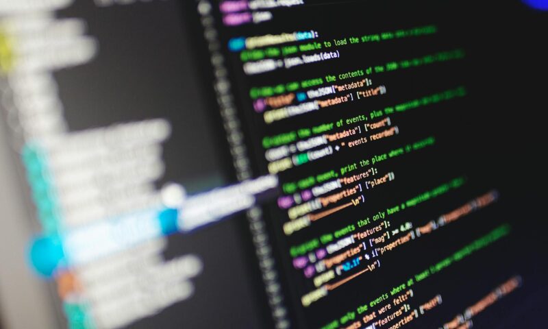 Close-up of a computer screen displaying colorful programming code in JavaScript.