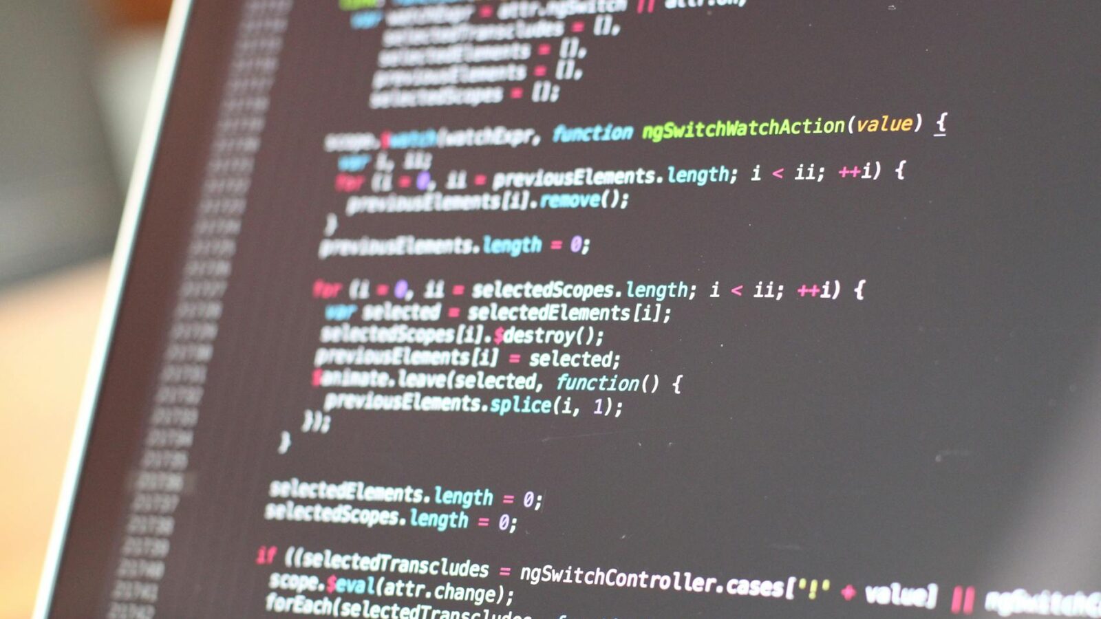 Close-up view of colorful code on a laptop screen, showcasing programming concepts.